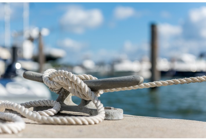 What is the difference between bollards and cleats on a boat?