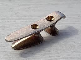 What is the difference between bollards and cleats on a boat?