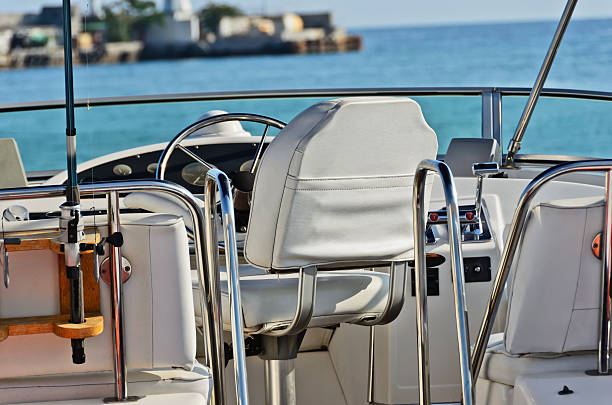 Cabin boat with a leather chair and sea fishing rod